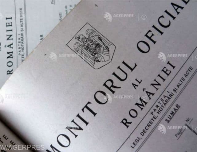 Monitorul Oficial al României, simbolizând acte legislative și decizii guvernamentale.