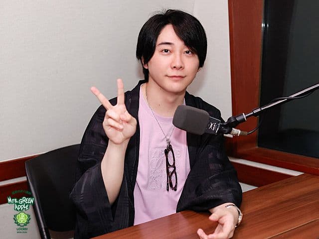 Motoki Ohmori of Mrs. GREEN APPLE in a studio setting, reflecting the band's introspective songwriting and profound lyrical depth.