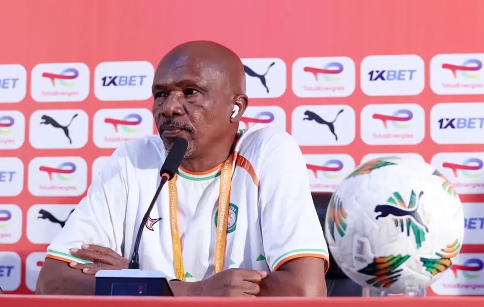 Niger's coach at a press conference, reflecting on the team's mental preparation and resilience.