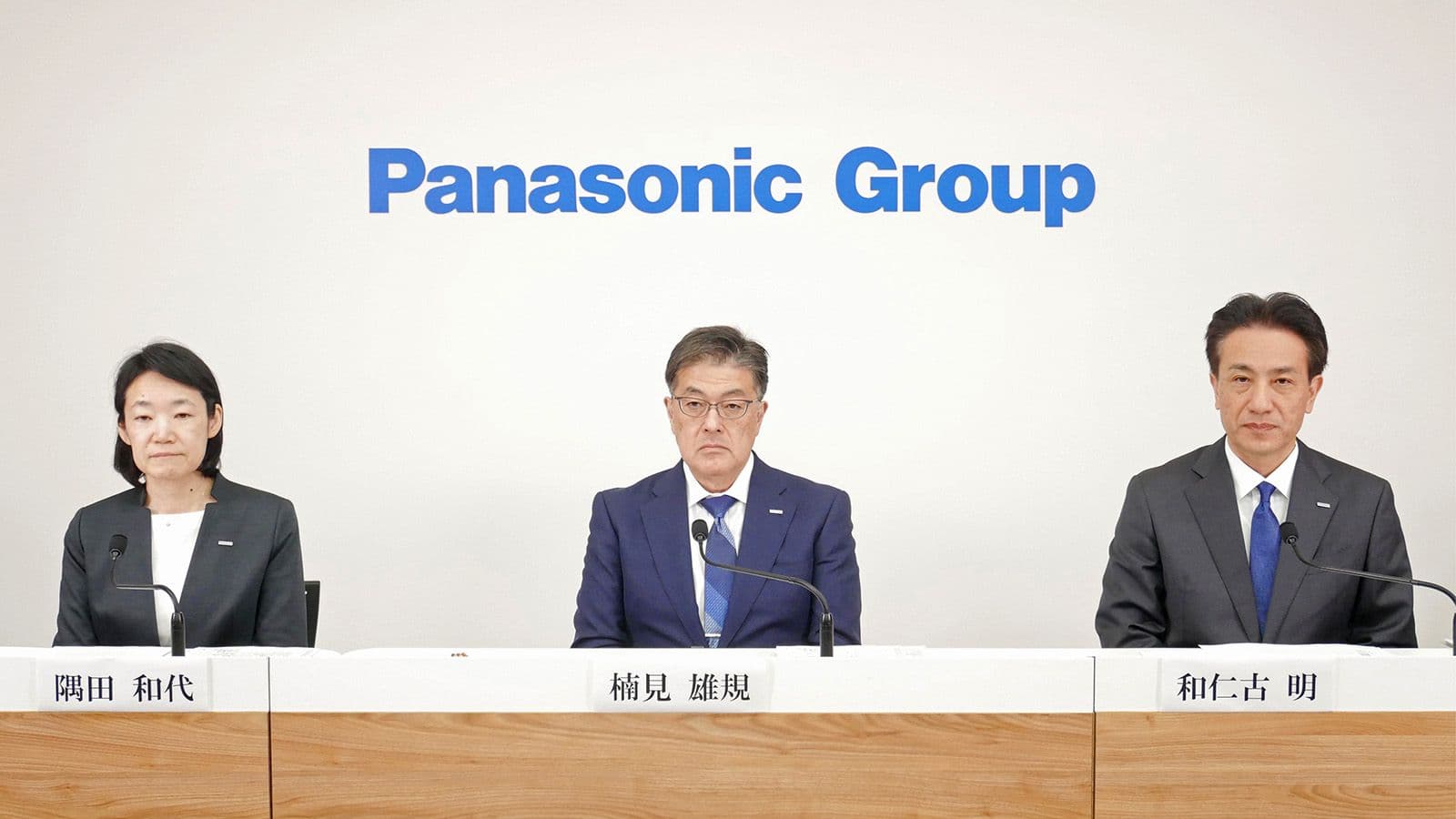 Panasonic Group executives at a press conference, announcing a strategic divestment in the housing sector