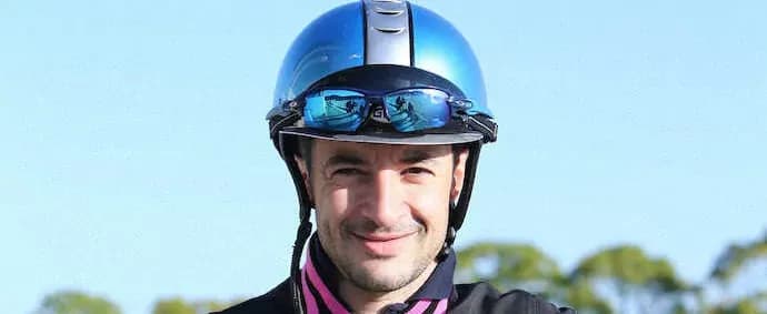 Portrait of Christophe Lemaire, a prominent jockey in Japan, representing the formidable homegrown heroes Karandagan will face.