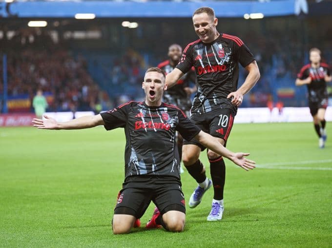 Sparta Prague football players celebrating a goal, representing the top teams vying for supremacy in the Chance Liga.