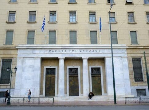 The exterior of the Bank of Greece building, representing the financial investment and economic recovery efforts.