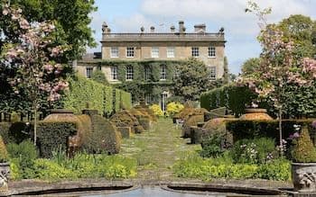 The grand Highgrove House with its meticulously designed gardens, showcasing King Charles's horticultural vision.