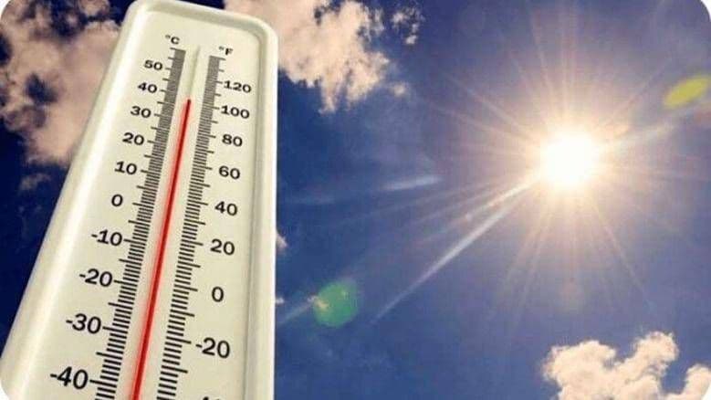 Thermometer showing high temperatures against a bright, sunny sky, representing the intense heat.