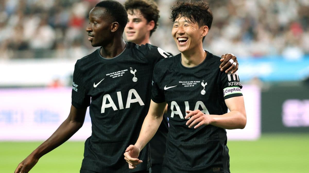 Tottenham Hotspur players Son Heung-min and teammate celebrating on the pitch, representing their fresh start.