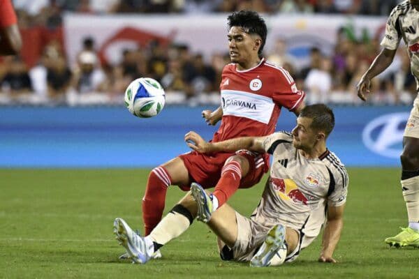Two football players in action during an MLS match, reflecting Grasshopper's connection to MLS ownership.