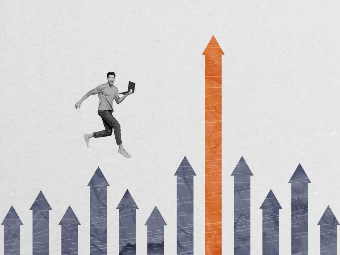 Wooden blocks spelling ETF, surrounded by coins and financial symbols, representing active ETF investments and growth potential.